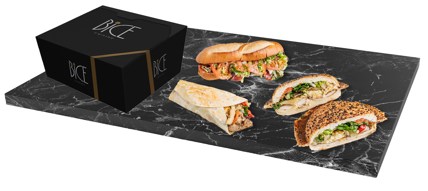 Boîte BICE et sandwichs gastronomiques présentés sur une dalle de marbre noir